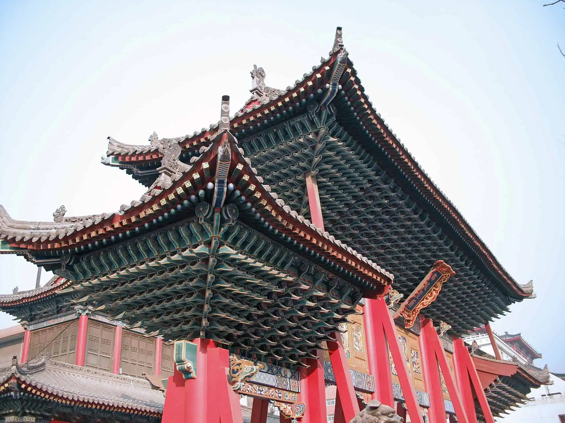 Ornate red paifang archway of Xi'an's City God (Chenghuang) Temple on West Street