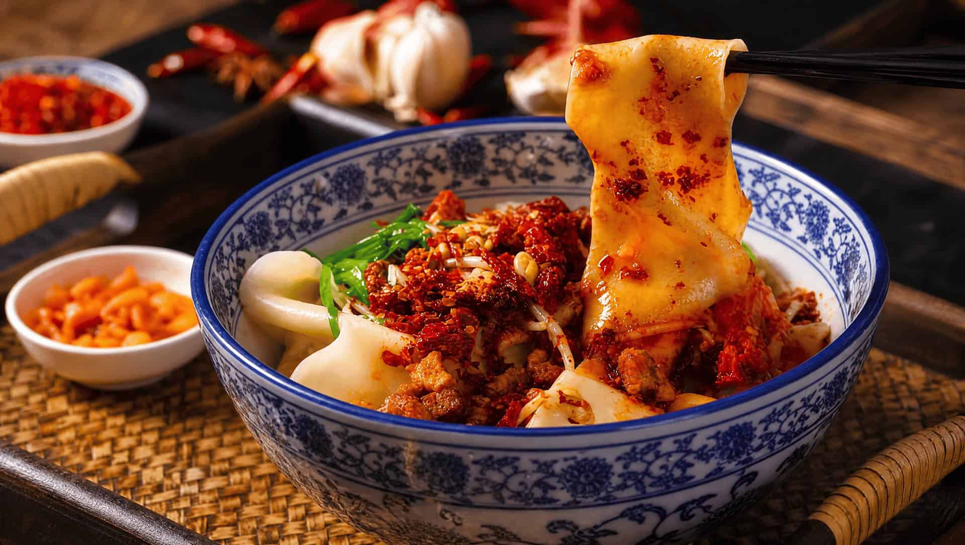 Biangbiang noodles: wide hand-pulled belt noodles with cilantro