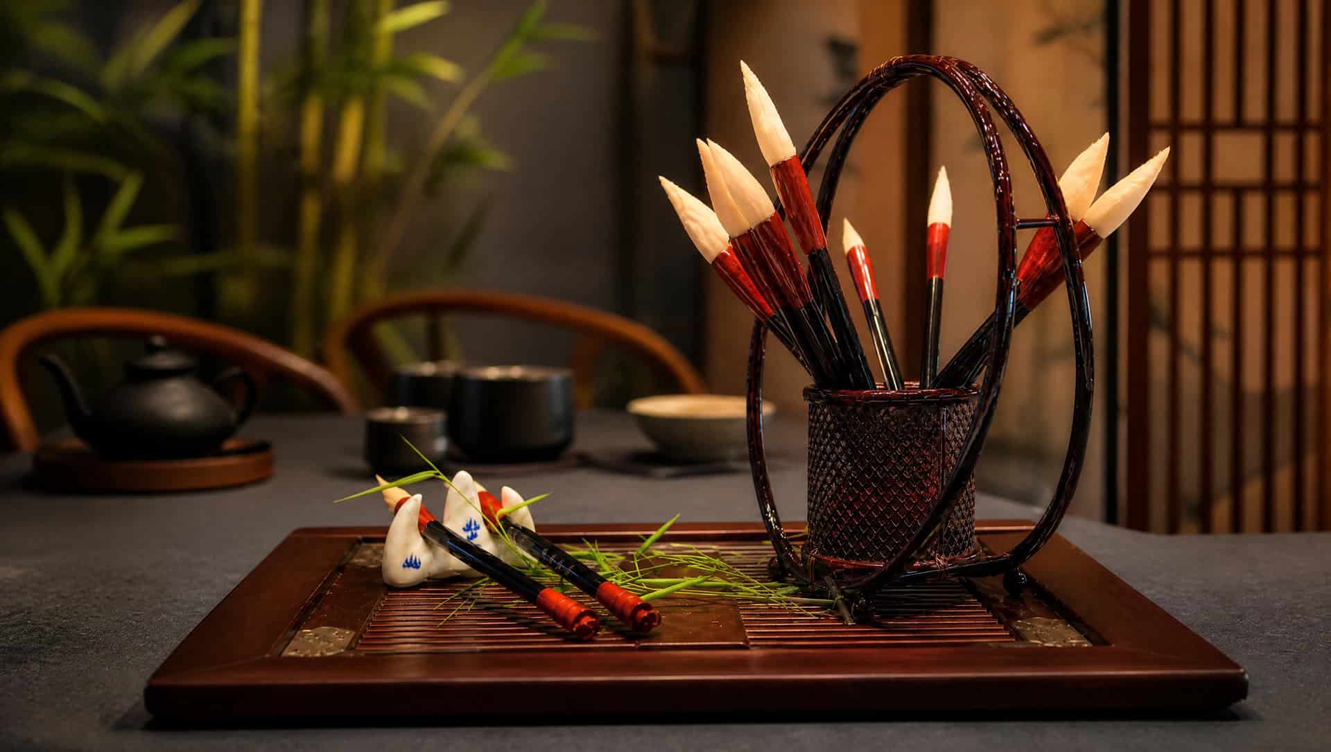 Calligraphy brush pastries — crisp pastry 'brushes' with a squid-ink tip and sugar 'ink stone', a Tang-themed Xi'an dessert