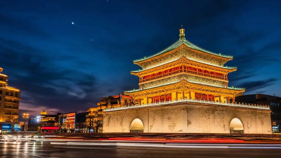 A gate tower of Xi'an's ancient city wall floodlit at night