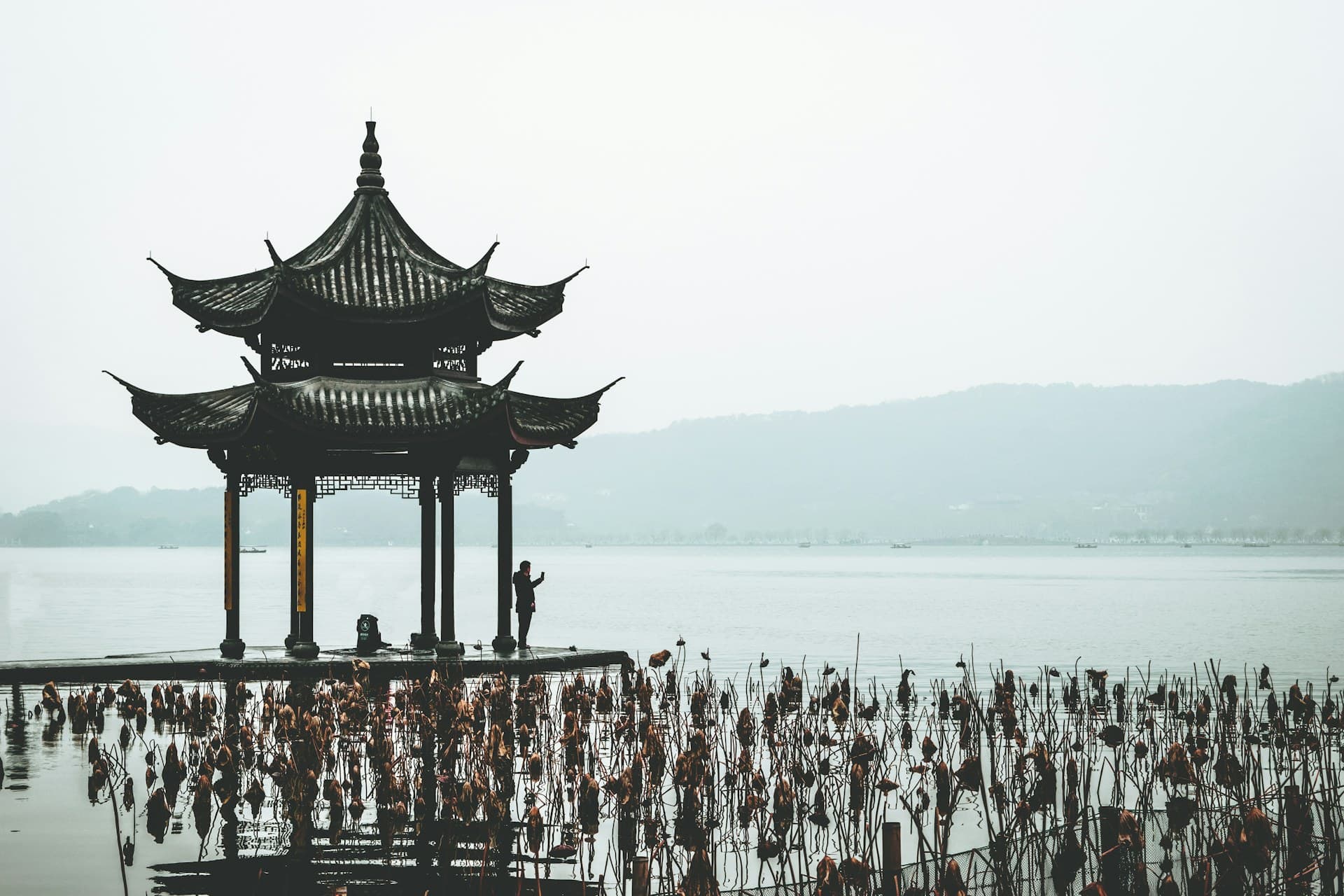 Pagoda silhouette over Qujiang Pool at dusk