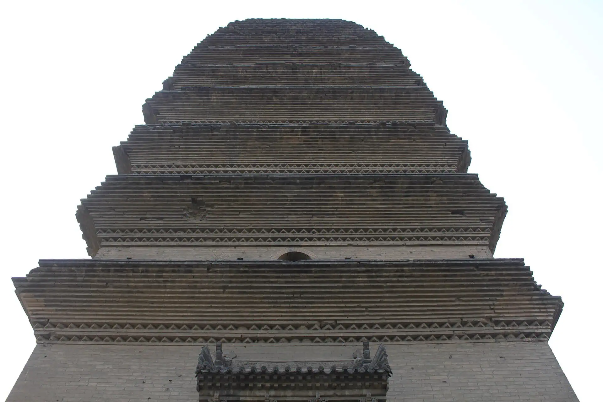 The Small Wild Goose Pagoda, a slender Tang-dynasty brick pagoda rising over courtyard trees in Xi'an