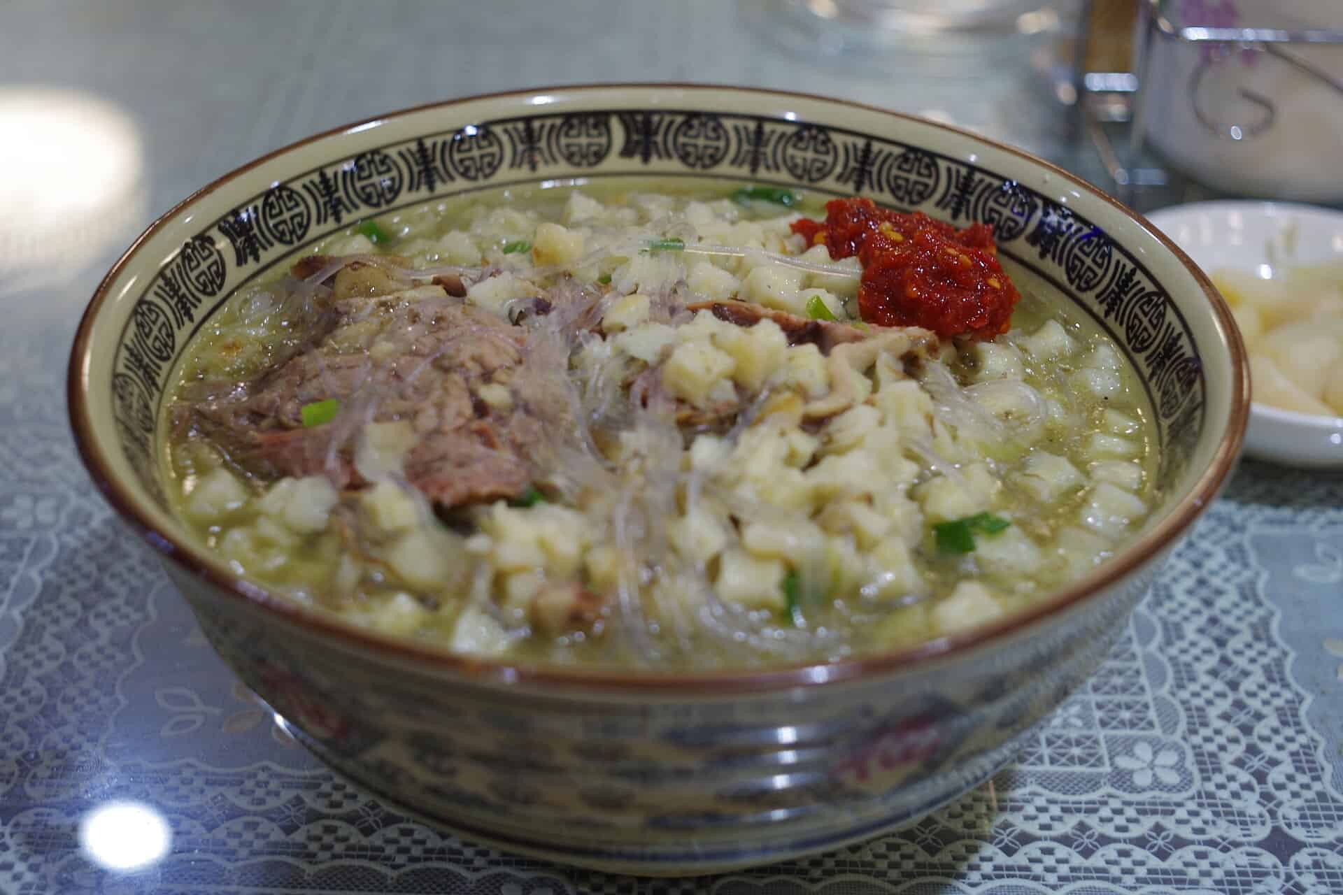 Yangrou paomo: lamb broth with hand-torn bread and chili paste